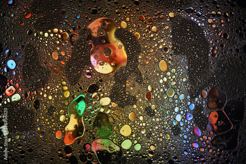 Fototapeta Naklejka Na Ścianę i Meble -  Multi coloured abstract background. Oil in water.