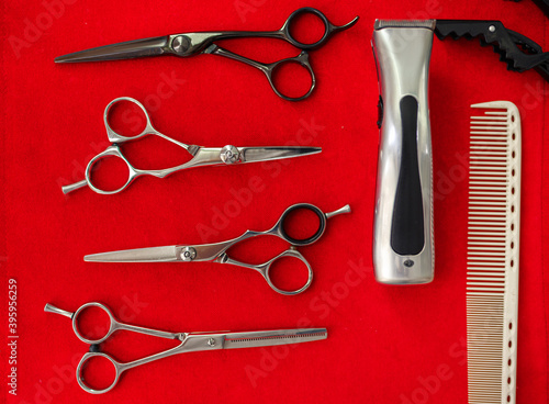 Hairdresser equipment, top view, red background