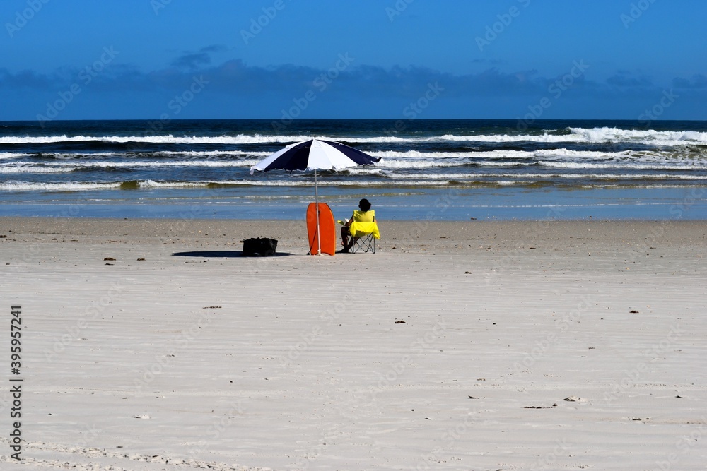Unrecognizable person alone at beach Florida, USA Unrecognizable person alone at beach Florida, USA