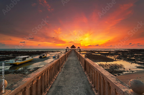 A long exposure picture of majestic sunrise with a jetty as a background at Tanjung Balau, Johore photo
