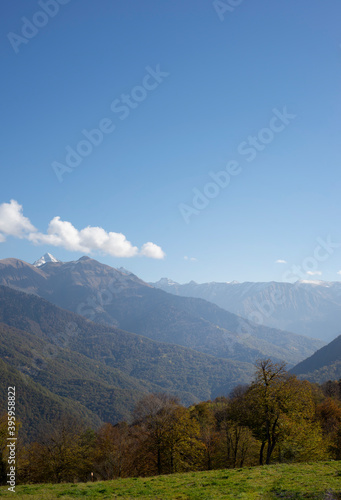  Mountain landscape against the blue sky. Vertical postcard with place for text. © LKoroleva