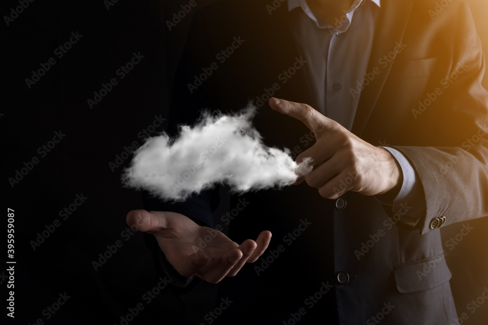 Businessman man hand holding cloud.Cloud computing concept, close up of young business man with cloud over his hand.The concept of cloud service.