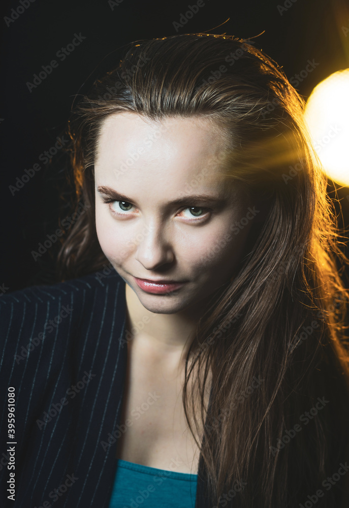 Naklejka premium Emotional portrait of a young beautiful girl in Vogue style. Expressive eyes and energetic gaze. Advertising photography. Perfumes, cosmetics and fashionable style.