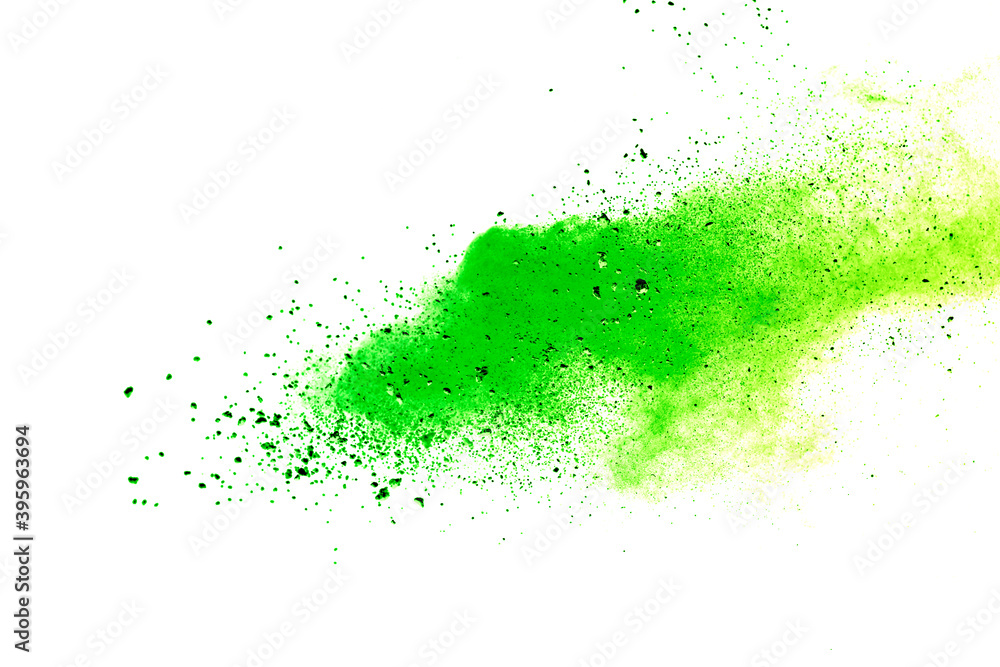 Freeze motion of green color powder exploding on white background. Freeze motion of green color powder exploding on white background.