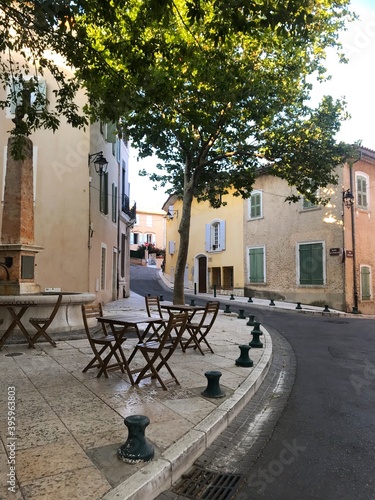 Beautiful side of quite suburban village in Luberon - Vitrolles  France. Small alley street with cafe chair and table. Vintage Italian feeling