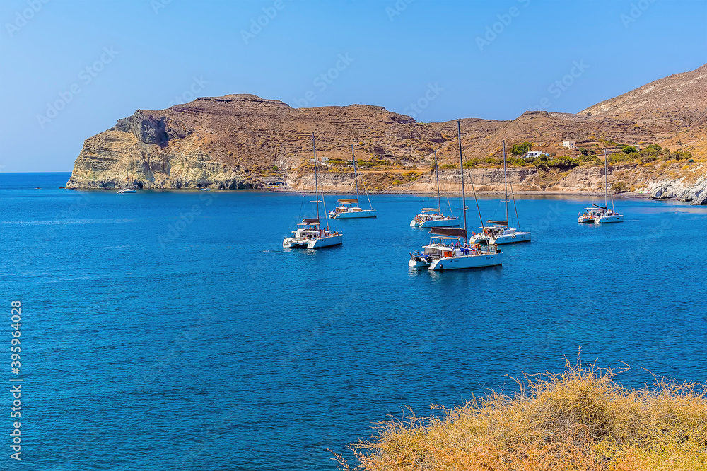 The view across the bay for the Red Beach in Santorini in summertime