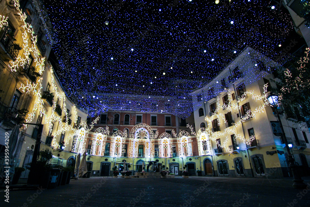 Obraz premium artist lights in an empty city. Christmas in a deserted city. Salerno Italy