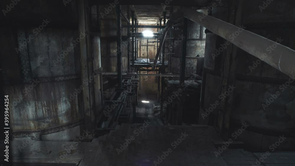 Gloomy boiler room of the old factory. Abandoned German pulp mill. Gloomy boiler room of the old factory. Abandoned German pulp mill.