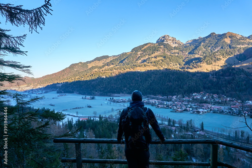 Man staring into the mountains from a cold spot