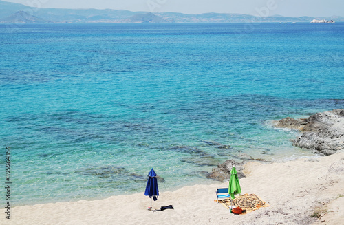 Naxos island Greece. Mikri Viglia village. Deserted, beautiful white sand beach by the turquoise blue sea. Idyllic destination. Copy space.