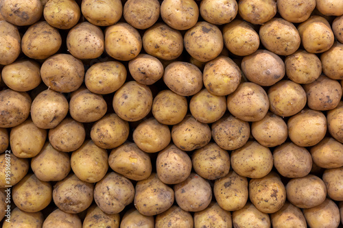 Close-up, potatoes standing in a row on the counter in the marketplace