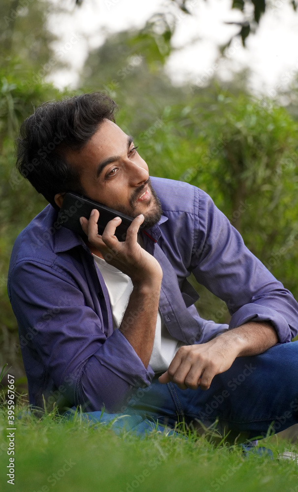 Indian man talking on a mobile phone Indian man talking on a mobile phone