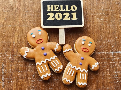 Set of cute gingerbread cookies for christmas with hello 2021 chalkboard 
