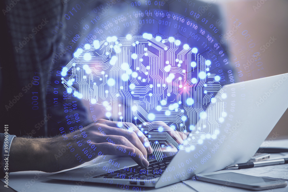 Man typing on keyboard background with brain hologram. Concept of big Data. Man typing on keyboard background with brain hologram. Concept of big Data.
