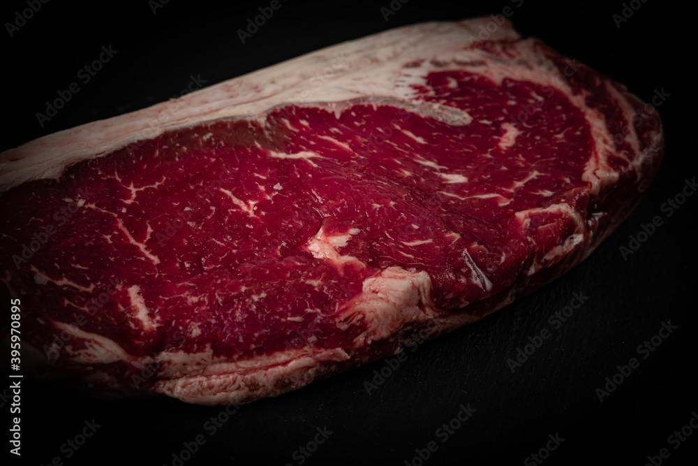 Raw ribeye beef steak. Texture of marble meat. Top view. 