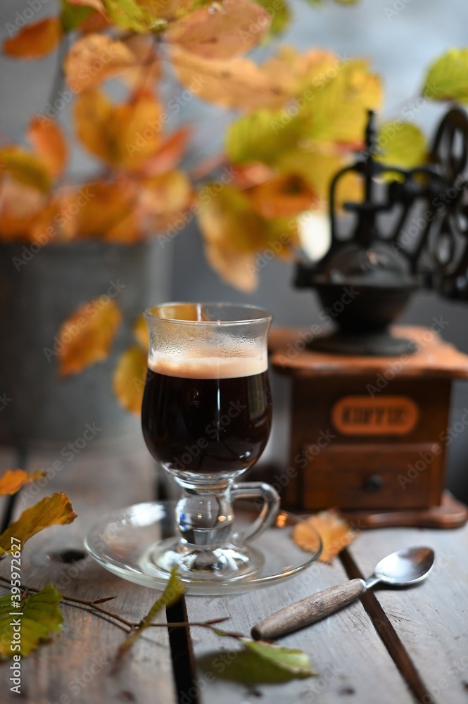 Autumn leaves, Coffee Grinder and cup of black coffee. Background for website, bloggers, social media. Autumn leaves, Coffee Grinder and cup of black coffee. Background for website, bloggers, social media.