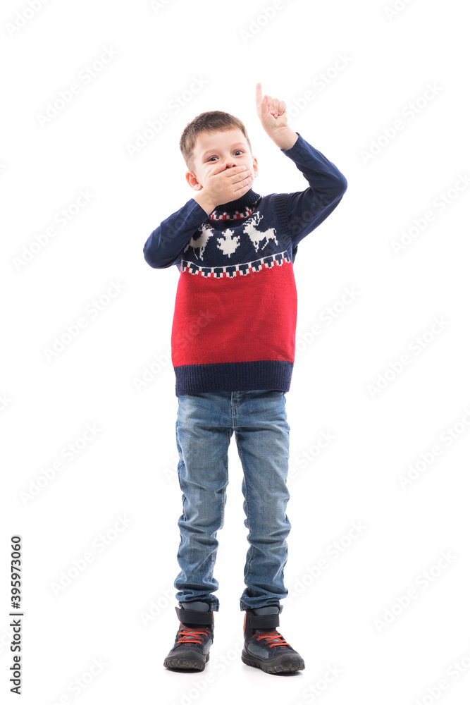 Shocked happy little kid pointing finger up above advertising with hand over mouth. Full body portrait isolated on white background. Shocked happy little kid pointing finger up above advertising with hand over mouth. Full body portrait isolated on white background.