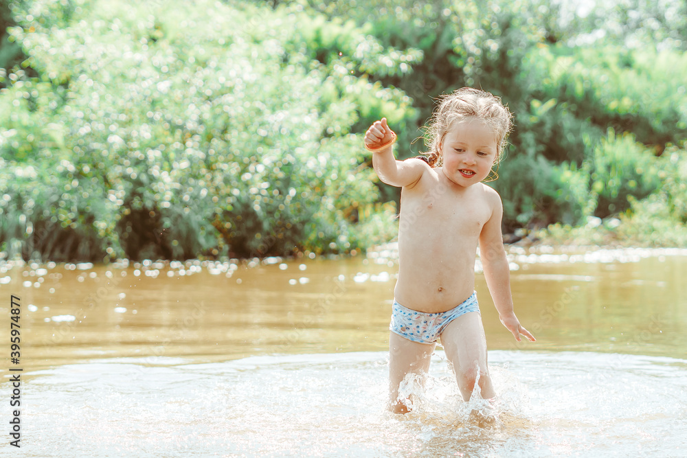 child playing in the river child playing in the river
