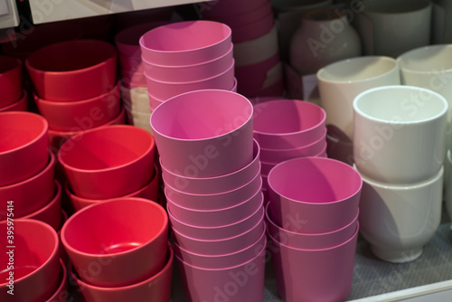 closeup of colorful plastic pots collection in a decoration store