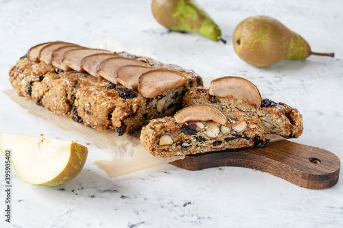 Birnenbrot with pear Christmas pastries. Pear bread is a traditional Swiss Alpine biscuit filled with dried pears, raisins and nuts.