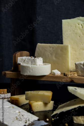 Traditional Greek cheeses on a dark background