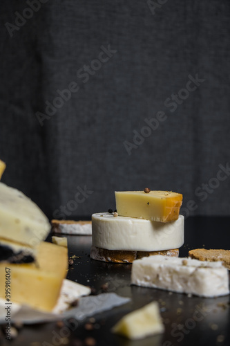 Traditional Greek cheeses on a dark background