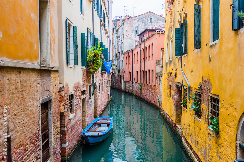 Venice canal and traditional colorful Venetian houses view. Classical Venice skyline. Venice, Italy.