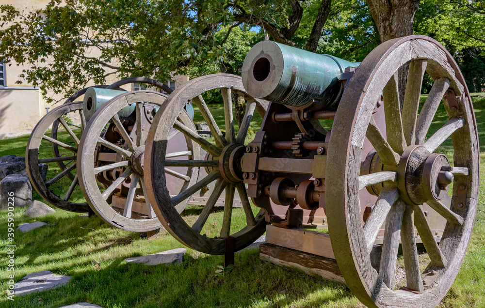 Old bronze cannons produced at the factories of the Russian Empire in the fortress of Suomenlinna. Defensive weapons in the bastion. Fortress copper guns.