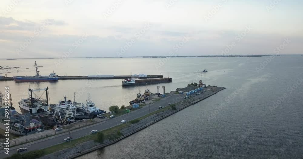 4K aerial early evening video of Lomonosov (Oranienbaum) harbour and port shipyard service area, Finnish Bay panorama, boats moored at Baltic Sea coast, in surroundings of Russia's northern capital 4K aerial early evening video of Lomonosov (Oranienbaum) harbour and port shipyard service area, Finnish Bay panorama, boats moored at Baltic Sea coast, in surroundings of Russia's northern capital