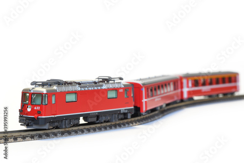 Scale model of red train isolated on white