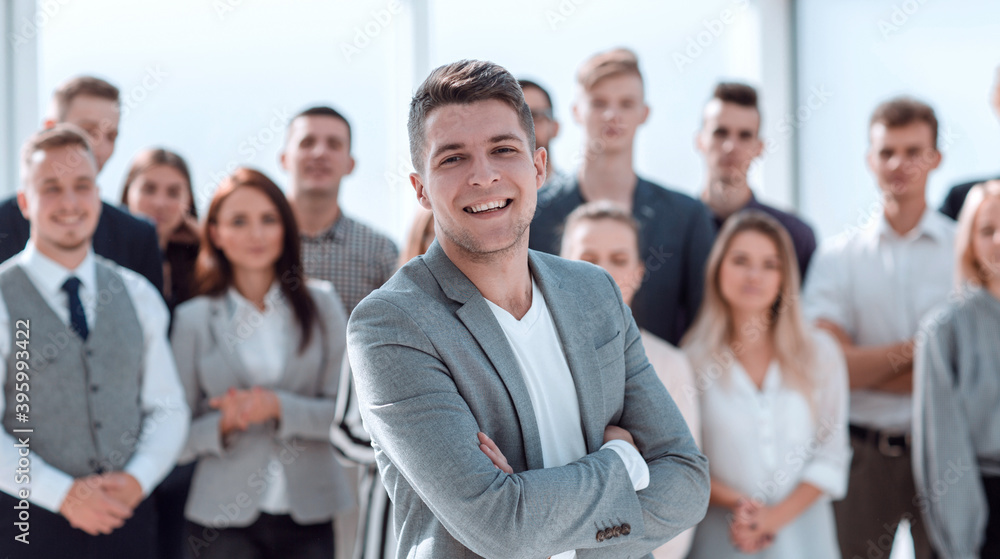 confident Manager standing at the front of the business team confident Manager standing at the front of the business team
