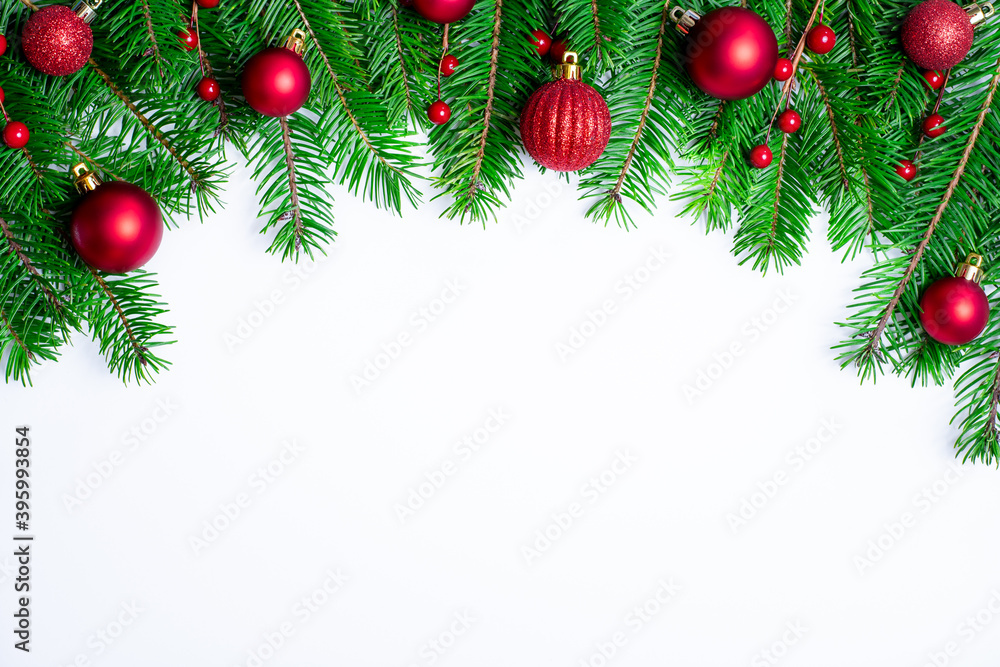 Christmas border background with fir branches and red balls