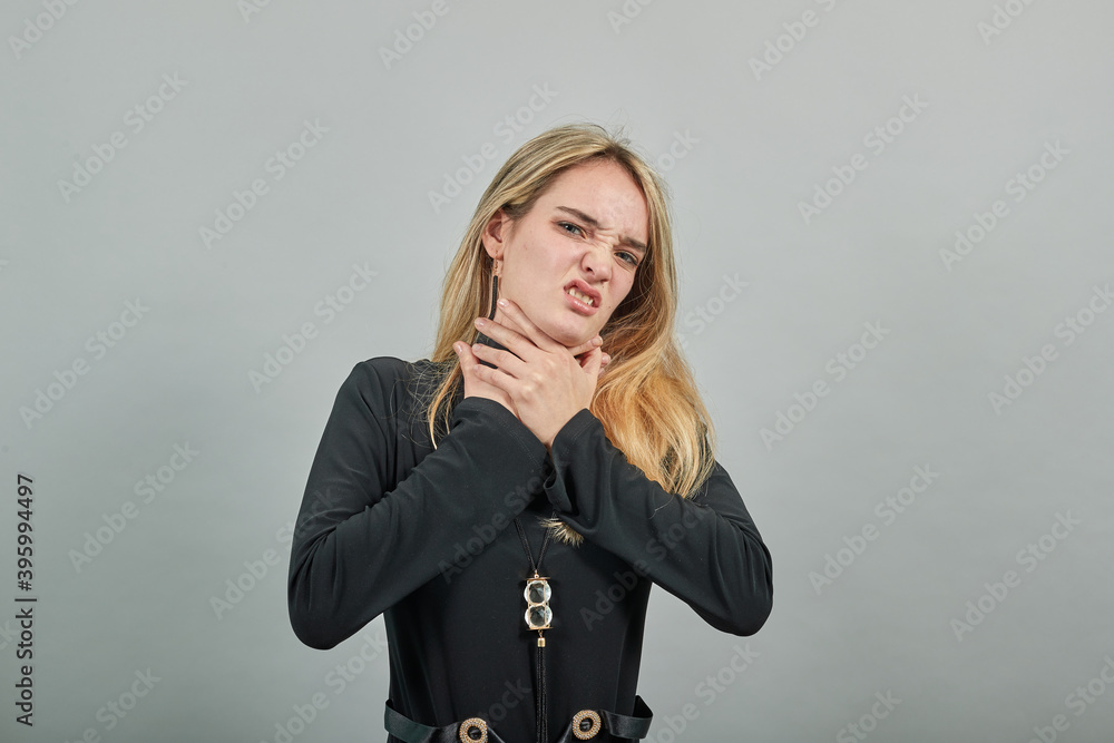 chokes on food stuck and is making the official international sign for