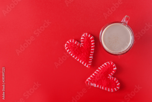 Red background with coffee and red hearts for Valentine's day