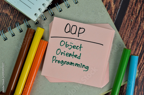 Fotografi OOP - Object Oriented Programming write on sticky notes isolated on Wooden Table