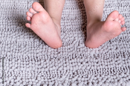  Close up children's legs on a fluffy carpet
