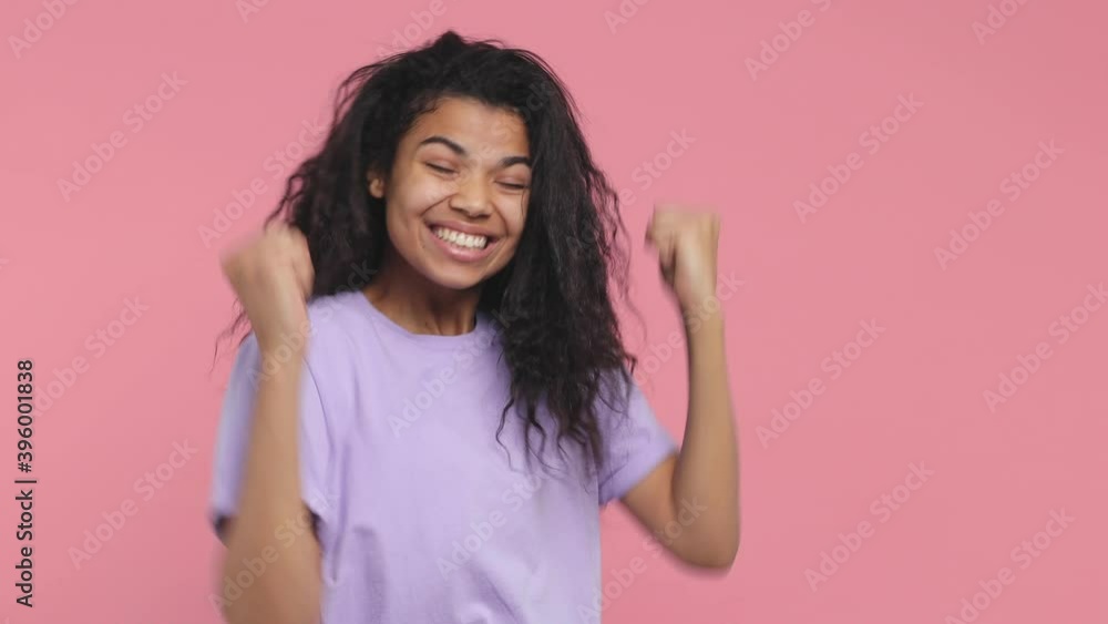 Side view surprised young african american woman 20s in violet t-shirt isolated on pink background studio. People lifestyle concept. Turn around on camera say wow doing winner gesture point on herself Side view surprised young african american woman 20s in violet t-shirt isolated on pink background studio. People lifestyle concept. Turn around on camera say wow doing winner gesture point on herself