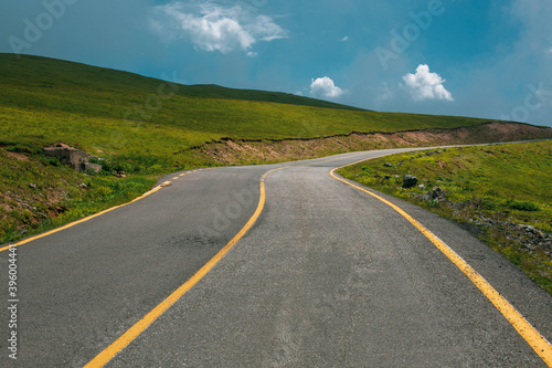 mountain road and green grass