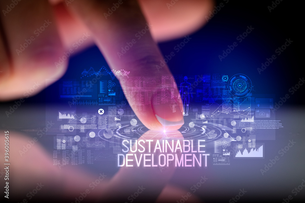 Finger touching tablet with web technology icons and SUSTAINABLE DEVELOPMENT inscription Finger touching tablet with web technology icons and SUSTAINABLE DEVELOPMENT inscription