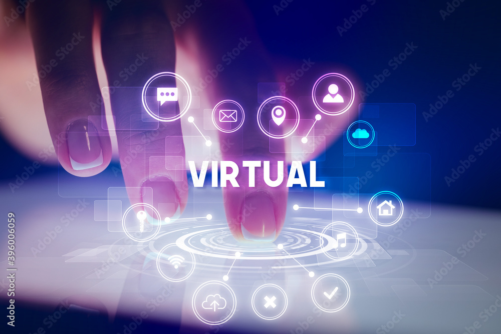 Finger touching tablet with web technology icons and VIRTUAL inscription, web technology concept Finger touching tablet with web technology icons and VIRTUAL inscription, web technology concept