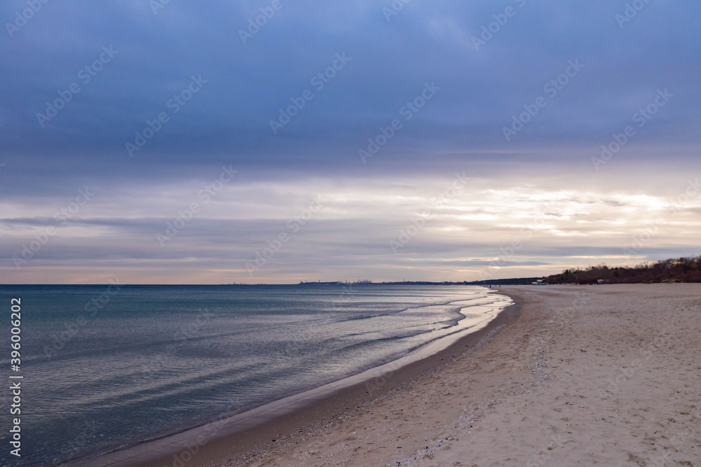 
beautiful calm sea waving in the early morning on a golden sandy beach