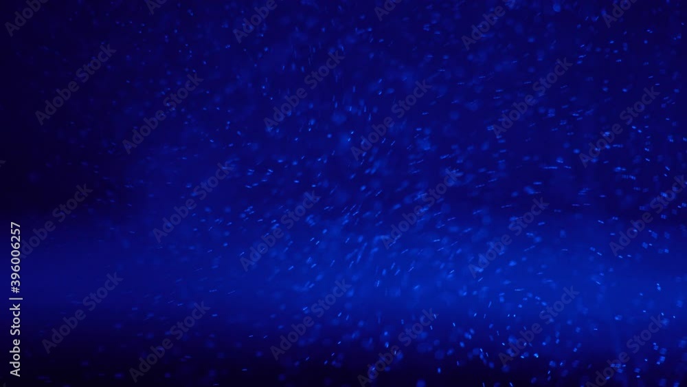 Bubbles of boiling water in a teapot with blue light close up Bubbles of boiling water in a teapot with blue light close up
