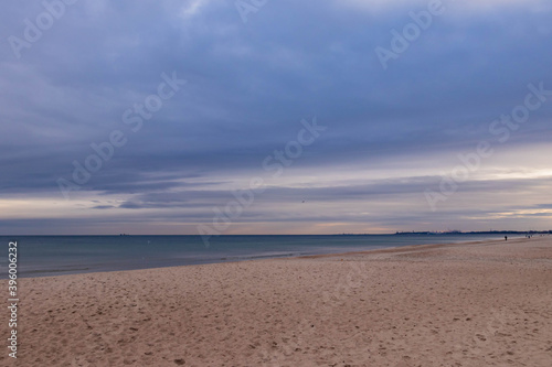beautiful calm sea waving in the early morning on a golden sandy beach