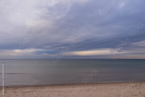 beautiful calm sea waving in the early morning on a golden sandy beach