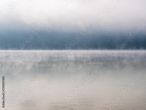 Weissensee with fog and mountains