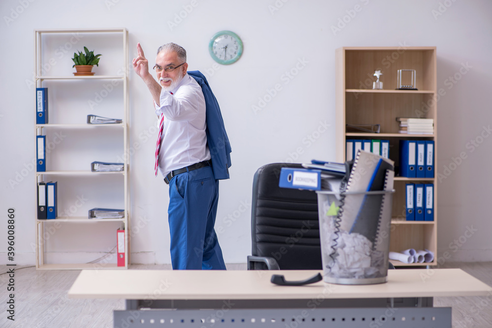 Old businessman employee rejecting new ideas with lots of papers Old businessman employee rejecting new ideas with lots of papers
