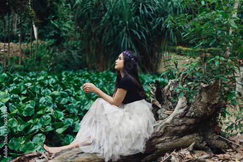 A Potraiture beautiful woman at the greening forest photo