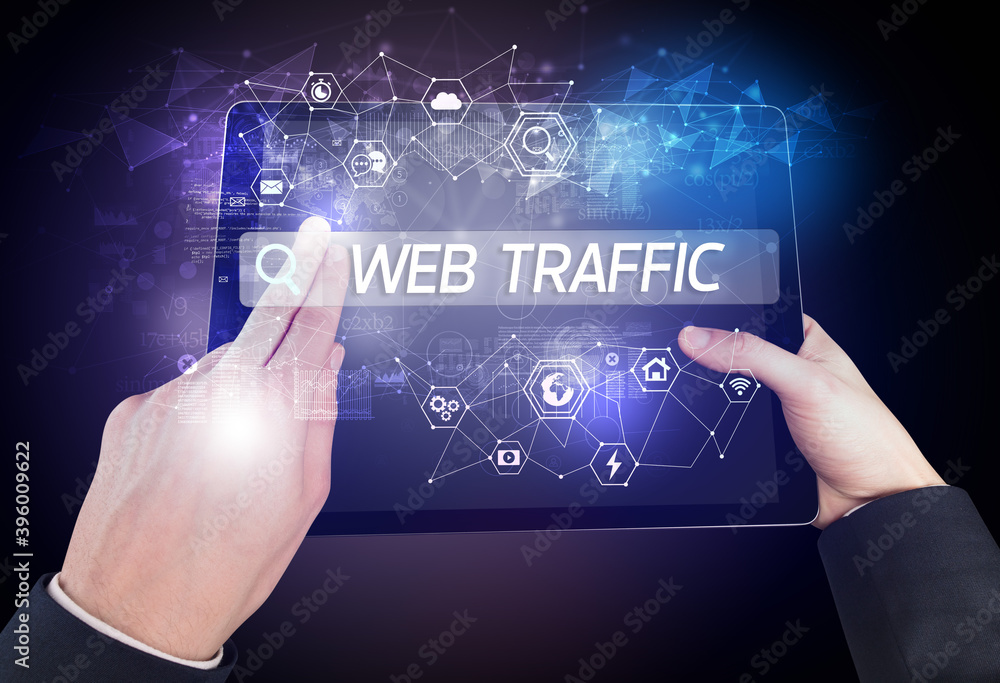 Obraz premium Close-up of a tablet searching WEB TRAFFIC inscription, hi-tech computing concept