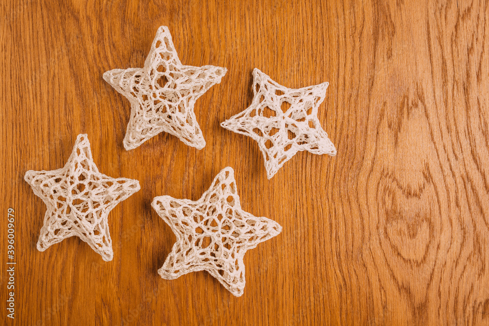 traditional crochet Christmas tree decorations, wooden background, christmas, flat lay