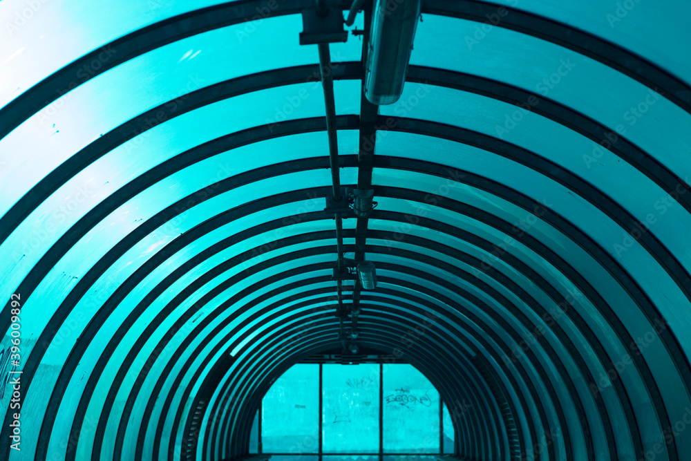Obraz premium An arched tunnel across the road. Inside the overhead passage above the track